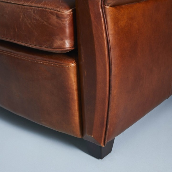 Fauteuil moustache en cuir pleine fleur