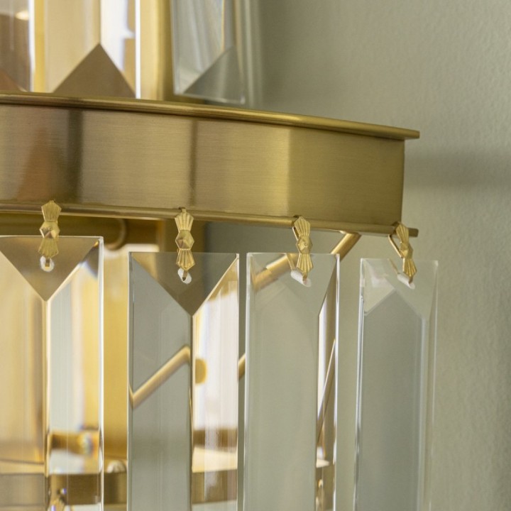 Fulgurant gold wall light